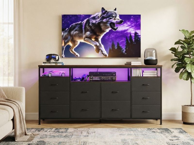 Console top panel loaded with a soundbar and streaming box beside a screen