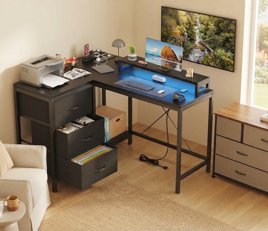 Patikuin L-Shaped Desk with Power Outlets in a furnished room